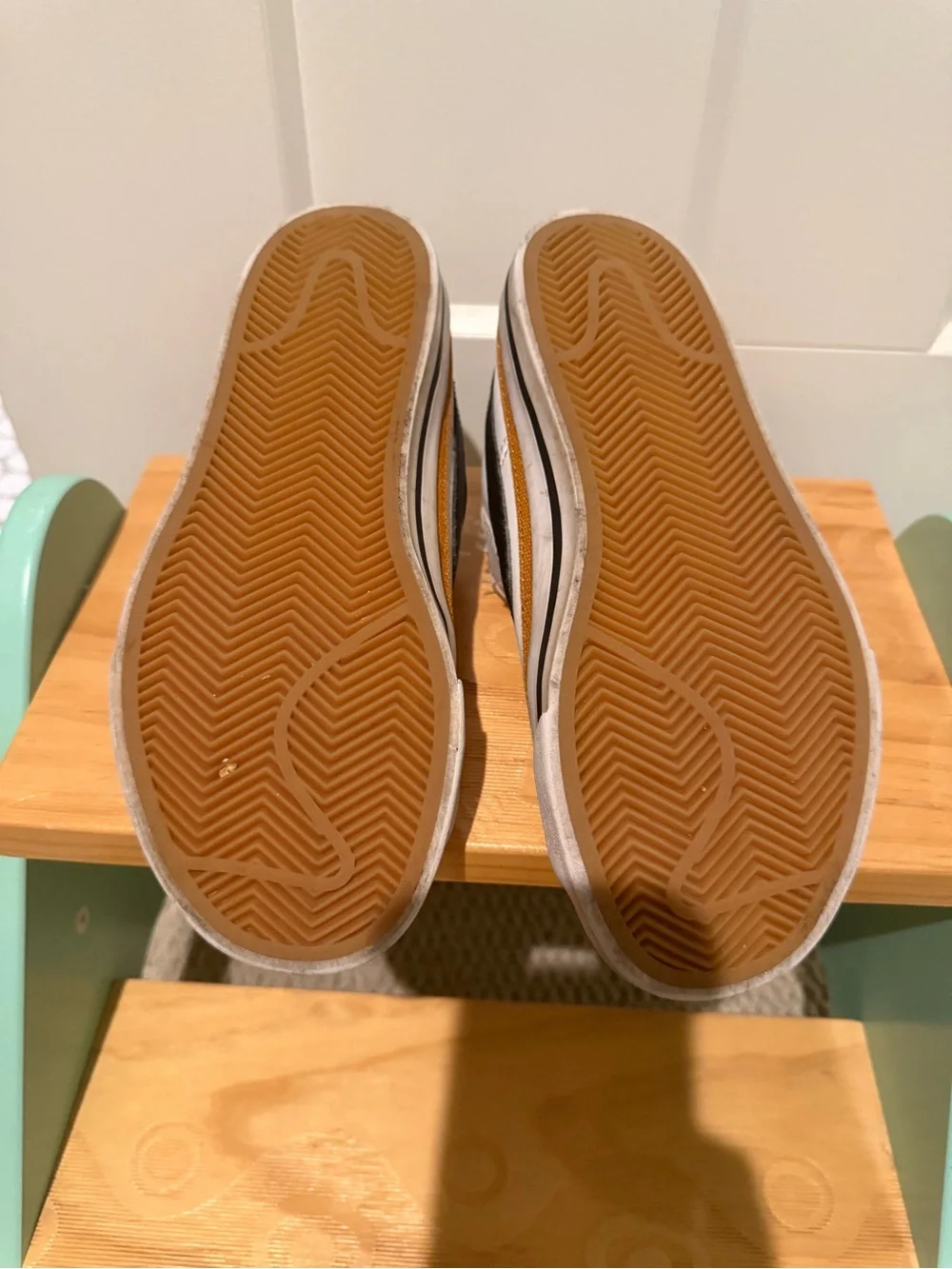 Nike Kids White Sneakers with Black Swoosh and Tan Stripe